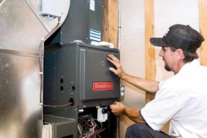 A professional technician installing a new Furnace system